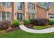 Stunning front entry with double doors and manicured landscaping at 878 Treadstone Overlook, Suwanee, GA 30024