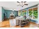 Spacious living room with fireplace, large windows, hardwood floors, and ceiling fans at 878 Treadstone Overlook, Suwanee, GA 30024