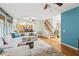 Bright living room with hardwood floors and staircase to the second level at 878 Treadstone Overlook, Suwanee, GA 30024