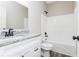 Bathroom features granite vanity, white cabinets, and a white tub with a shower at 1100 Pleasant Grove Church Rd, Villa Rica, GA 30180