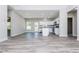 Open-concept living space with wood floors, white walls, and a modern kitchen at 1100 Pleasant Grove Church Rd, Villa Rica, GA 30180
