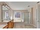 Primary bath featuring dual sinks, soaking tub, and glass enclosed shower at 2765 Turning Leaf Dr, Lawrenceville, GA 30044