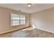 Bedroom featuring hardwood floors, window, and natural light at 2765 Turning Leaf Dr, Lawrenceville, GA 30044