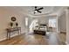 Spacious bedroom featuring hardwood floors, a ceiling fan, and tray ceiling at 2765 Turning Leaf Dr, Lawrenceville, GA 30044
