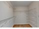 Walk-in closet offering ample storage space with metal shelving at 2765 Turning Leaf Dr, Lawrenceville, GA 30044