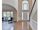 Grand foyer featuring high ceilings, hardwood floors, and a staircase at 2765 Turning Leaf Dr, Lawrenceville, GA 30044