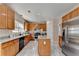 Open kitchen features granite countertops, modern appliances, and ample cabinet space at 2765 Turning Leaf Dr, Lawrenceville, GA 30044