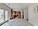 Bright, spacious kitchen with tile floors, stone countertops and view to rear patio at 2765 Turning Leaf Dr, Lawrenceville, GA 30044