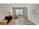 Cozy living room featuring hardwood floors, a window, and decor at 2765 Turning Leaf Dr, Lawrenceville, GA 30044