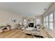 Inviting living room with fireplace, hardwood floors, and lots of natural light at 2765 Turning Leaf Dr, Lawrenceville, GA 30044