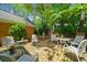 Brick patio with outdoor seating area and a brick house with tree coverage at 3120 Henderson Walk, Atlanta, GA 30340