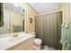 Bathroom with striped wallpaper, a white sink, and a shower with a curtain at 3120 Henderson Walk, Atlanta, GA 30340