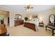 Bright bedroom with neutral walls, a bed, an ensuite bathroom, and traditional furniture at 3120 Henderson Walk, Atlanta, GA 30340