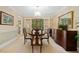 This dining room features an elegant chandelier and french doors leading to the outside at 3120 Henderson Walk, Atlanta, GA 30340