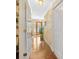 Hallway showcasing wood floors and a view of the front door at 3120 Henderson Walk, Atlanta, GA 30340
