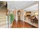 Hallway view leading to the living room, featuring hardwood floors and a staircase at 3120 Henderson Walk, Atlanta, GA 30340