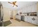 This kitchen has granite countertops, white cabinets and stainless steel appliances at 3120 Henderson Walk, Atlanta, GA 30340