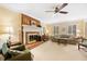 Well-lit living room featuring a brick fireplace, classic furniture, and neutral color palette at 3120 Henderson Walk, Atlanta, GA 30340