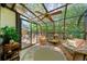 This is a sun room with a glass ceiling and a view of the fenced backyard at 3120 Henderson Walk, Atlanta, GA 30340