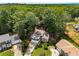 Aerial view of a charming home surrounded by lush trees in a residential neighborhood at 4816 Morning Chase Nw, Acworth, GA 30102