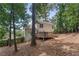Back of home featuring a spacious deck, outdoor seating, and landscaped backyard at 4816 Morning Chase Nw, Acworth, GA 30102