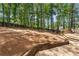 Expansive backyard featuring a deck, patio, and landscaped area, providing ample space for outdoor activities and entertaining at 4816 Morning Chase Nw, Acworth, GA 30102