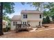 Back of home with deck and outdoor seating, overlooking landscaped backyard at 4816 Morning Chase Nw, Acworth, GA 30102