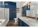 Modern bathroom boasts a double vanity, marble countertops, a walk-in shower, and a separate bathtub at 4816 Morning Chase Nw, Acworth, GA 30102