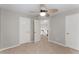 Bedroom with neutral carpet, ceiling fan, and two closets at 4816 Morning Chase Nw, Acworth, GA 30102