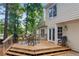 Deck with grill, table, seating, and stairs down to yard at 4816 Morning Chase Nw, Acworth, GA 30102