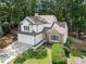Charming two-story home with stone accents, attached garage, mature trees, and well-maintained landscaping at 4816 Morning Chase Nw, Acworth, GA 30102