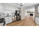 Updated kitchen offers stainless steel appliances, granite countertops, and an open view to the living room at 4816 Morning Chase Nw, Acworth, GA 30102