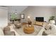 Cozy living room featuring stylish furniture, a rug, and an adjacent dining area at 4816 Morning Chase Nw, Acworth, GA 30102