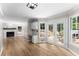 The kitchen and living room connect, with views to the outdoor deck and a cozy fireplace for relaxation at 4816 Morning Chase Nw, Acworth, GA 30102