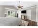Spacious main bedroom features a ceiling fan, large window, and dark wood flooring at 4816 Morning Chase Nw, Acworth, GA 30102
