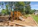 A wooden playground set provides fun activities for children within the community at 4816 Morning Chase Nw, Acworth, GA 30102