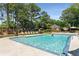Sparkling community pool with lounge chairs, umbrellas, and a sunbathing area for residents at 4816 Morning Chase Nw, Acworth, GA 30102