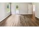 Bright, airy bedroom with wood-look flooring, a window with a backyard view, and neutral walls at 1102 Ola Dale Ct, Mcdonough, GA 30252
