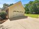 Attached two car garage with an extended driveway and beautiful lawn at 1102 Ola Dale Ct, Mcdonough, GA 30252