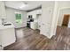 Modern kitchen features white cabinets, stainless steel appliances, and sleek countertops at 1102 Ola Dale Ct, Mcdonough, GA 30252