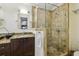 Modern bathroom with granite counters and a glass-enclosed shower with tiled surround at 1151 Roxboro Ne Cv, Atlanta, GA 30324