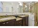 Beautiful bathroom with granite counters, dual sinks, and a glass-enclosed shower at 1151 Roxboro Ne Cv, Atlanta, GA 30324