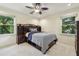 Comfortable bedroom featuring a decorative ceiling fan and natural light from large windows at 1151 Roxboro Ne Cv, Atlanta, GA 30324