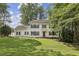 Classic colonial home features a manicured lawn and mature shade trees at 1151 Roxboro Ne Cv, Atlanta, GA 30324
