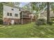 Back of the house with deck, screened in porch, and landscaped backyard at 1151 Roxboro Ne Cv, Atlanta, GA 30324