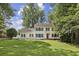 Beautiful home with a well-manicured lawn, a classic design, and mature trees at 1151 Roxboro Ne Cv, Atlanta, GA 30324