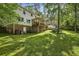 Back of the house with deck, screened in porch, and large backyard at 1151 Roxboro Ne Cv, Atlanta, GA 30324