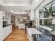 Open concept kitchen featuring granite countertops, stainless appliances, and abundant natural light at 1151 Roxboro Ne Cv, Atlanta, GA 30324