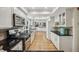 Bright kitchen with white cabinets, stainless appliances, granite countertops, and an open layout at 1151 Roxboro Ne Cv, Atlanta, GA 30324