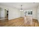 Spacious living room with hardwood floors and natural light from adjacent rooms at 1151 Roxboro Ne Cv, Atlanta, GA 30324